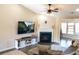 Cozy living room featuring a fireplace, modern entertainment setup, and comfortable seating at 203 Goldfinch Ln, Summerville, SC 29485