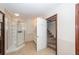 Bathroom featuring a tiled shower, vanity sink, and access to the staircase at 210 Lakeview Dr, Summerville, SC 29485