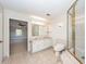 Bathroom with a double vanity, tiled floor, and a glass-enclosed shower, accessible from an open doorway at 210 Lakeview Dr, Summerville, SC 29485