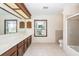 Bathroom featuring dual sinks, granite counters, tiled floor and shower/tub combo at 210 Lakeview Dr, Summerville, SC 29485