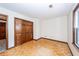 Bedroom featuring parquet floors, white walls, natural light and closet with dark wood at 210 Lakeview Dr, Summerville, SC 29485