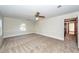 Large bedroom with neutral carpet, a ceiling fan and big windows at 210 Lakeview Dr, Summerville, SC 29485