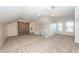 Upstairs bonus room with neutral carpet, a brick accent wall and ample natural light at 210 Lakeview Dr, Summerville, SC 29485