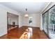 Bright dining area offers hardwood floors, wainscotting, and sliding glass doors at 210 Lakeview Dr, Summerville, SC 29485