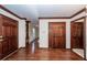 Home entryway featuring hardwood floors, wooden doors, and decorative trim at 210 Lakeview Dr, Summerville, SC 29485