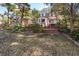 Classic two-story brick house with lush landscaping, patios and manicured lawn at 210 Lakeview Dr, Summerville, SC 29485