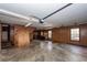 Well-lit garage with wood paneled walls, storage cabinets and an automatic garage door at 210 Lakeview Dr, Summerville, SC 29485
