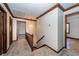 Upstairs hallway with hardwood trim, carpet flooring, and decorative chandelier at 210 Lakeview Dr, Summerville, SC 29485