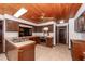 Open kitchen with stainless appliances, tile countertops and an island with sink at 210 Lakeview Dr, Summerville, SC 29485