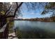 Peaceful lake view from a private dock featuring calm waters and distant homes at 210 Lakeview Dr, Summerville, SC 29485