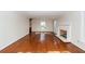 Neutral living room featuring hardwood floors, a fireplace, and abundant natural light at 210 Lakeview Dr, Summerville, SC 29485