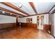 Large Living Room featuring wood beamed ceiling, wood floors, and access to deck at 210 Lakeview Dr, Summerville, SC 29485