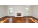 Bright and airy living room with hardwood floors, a fireplace, and large windows at 210 Lakeview Dr, Summerville, SC 29485