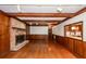 Cozy living room features a brick fireplace, wood beamed ceiling, and wood floors at 210 Lakeview Dr, Summerville, SC 29485