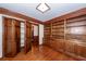 Spacious office with beautiful hardwood flooring and custom built-in shelving at 210 Lakeview Dr, Summerville, SC 29485