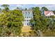 Areal view of a three-story house with a new metal roof, overlooking beautiful surroundings at 217 King George St, Daniel Island, SC 29492