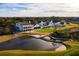 Scenic aerial shot of a golf course community with beautiful club house and a tranquil lake at 217 King George St, Daniel Island, SC 29492