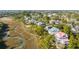 Aerial view showcasing waterfront homes surrounded by lush vegetation and tranquil waterways at 217 King George St, Daniel Island, SC 29492