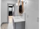 Modern bathroom featuring neutral paint, decorative flooring, and a rectangular sink at 217 King George St, Daniel Island, SC 29492