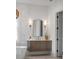 Bright bathroom featuring a vanity with a sink, decorative mirror and lighting at 217 King George St, Daniel Island, SC 29492