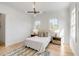 Bright bedroom with hardwood floors, and a stylish rug at 217 King George St, Daniel Island, SC 29492