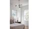 Bright bedroom featuring natural light, stylish light fixture, and neutral decor at 217 King George St, Daniel Island, SC 29492