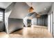 Bright bonus room featuring hardwood floors, natural light and modern lighting fixtures at 217 King George St, Daniel Island, SC 29492