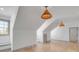 Bonus room with hardwood floors, modern lighting and ample natural light at 217 King George St, Daniel Island, SC 29492