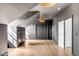 Spacious bonus room features gray paint, wood floors, and double door closet at 217 King George St, Daniel Island, SC 29492