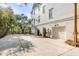 Multi-story home with white siding, multiple garage doors, and a spacious driveway at 217 King George St, Daniel Island, SC 29492
