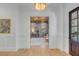 Elegant foyer with hardwood floors and classic white trim, leading into a bright and inviting office space at 217 King George St, Daniel Island, SC 29492