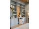 Stylish home office with custom shelving, sleek desk, and comfortable chair at 217 King George St, Daniel Island, SC 29492