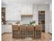 Bright modern kitchen with a center island, counter seating, and stainless steel appliances at 217 King George St, Daniel Island, SC 29492