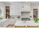 Bright kitchen featuring white cabinetry, stainless steel appliances, a kitchen island and wooden accents at 217 King George St, Daniel Island, SC 29492