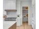 Gourmet kitchen featuring stainless steel appliances, custom cabinetry, and a modern tile backsplash at 217 King George St, Daniel Island, SC 29492