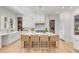 Bright, airy kitchen with a large center island, modern appliances, and sleek white cabinetry, perfect for entertaining at 217 King George St, Daniel Island, SC 29492