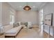 Inviting living room featuring a large white sofa, decorative pillows, and elegant lighting at 217 King George St, Daniel Island, SC 29492