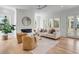 Bright living room with fireplace, comfortable seating, and natural light from large windows at 217 King George St, Daniel Island, SC 29492