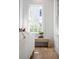 Bright, naturally lit living room with stylish window bench and decorative accents at 217 King George St, Daniel Island, SC 29492