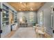 Stylish office features custom built-ins, light hardwood floors, and soft lighting, creating a serene and productive workspace at 217 King George St, Daniel Island, SC 29492