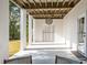 Covered patio with pillars and exposed ceiling featuring outdoor access and seating at 217 King George St, Daniel Island, SC 29492