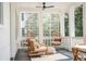 Relaxing porch with hanging chairs, comfortable seating, and stylish decor at 217 King George St, Daniel Island, SC 29492