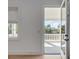 View of the house's porch with a beautiful view and a light-filled doorway at 217 King George St, Daniel Island, SC 29492