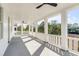 Spacious porch area with columns and ceilings fans that extend the length of the house at 217 King George St, Daniel Island, SC 29492