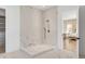 This shower is clad in marble tile and has a bench seat for a luxurious experience at 217 King George St, Daniel Island, SC 29492