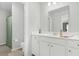Bright bathroom featuring a white vanity and a toilet hidden behind a shower with a green curtain at 229 Celestial Blvd, Summerville, SC 29486