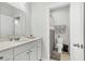 Bright bathroom featuring a white vanity, ample counter space, and decorative shower curtain at 229 Celestial Blvd, Summerville, SC 29486