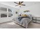 Cozy bedroom with large window, ceiling fan, and a comfortable bed with stylish bedding at 229 Celestial Blvd, Summerville, SC 29486