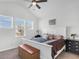 Bright bedroom boasts vaulted ceiling, three windows, and a well-appointed queen bed at 229 Celestial Blvd, Summerville, SC 29486