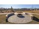 Brick fire pit area with beautiful landscaping in the community at 229 Celestial Blvd, Summerville, SC 29486